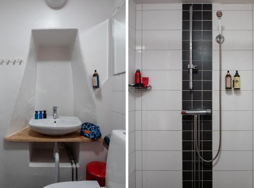 a bathroom with a toilet and a sink and a shower at Castle House Inn in Stockholm
