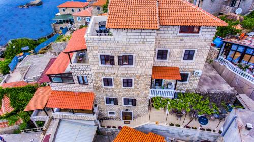 an aerial view of a large house with orange roofs at Villa Marinero in Ulcinj