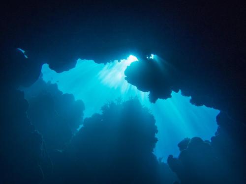an underwater cave with a blue ocean floor at Oneta Resort in Ono Island