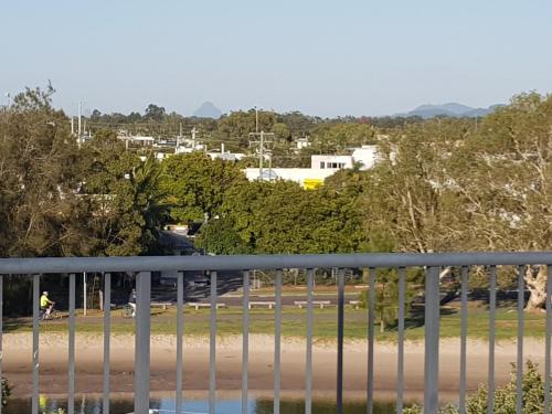 a person riding a bike on a bridge at Excellsior Apartments in Mooloolaba