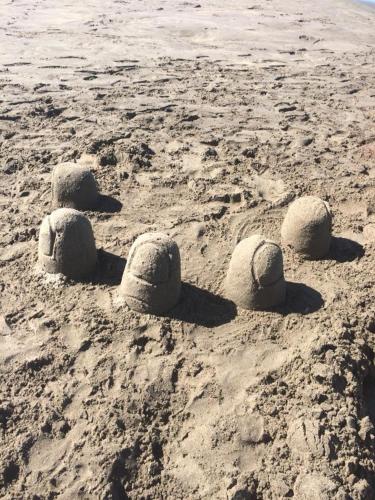 a sand castle formation on a beach at Thornton Beach Holiday park in Thornton