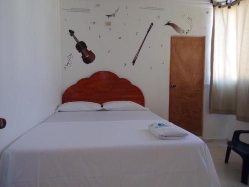 Hotel Monaco De Riohachaにあるベッド