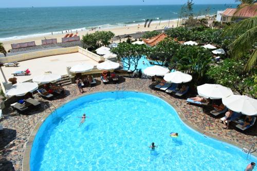 an overhead view of a swimming pool with a beach at Swiss Village Resort & Spa in Mui Ne