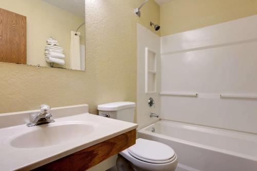 a bathroom with a sink and a toilet and a tub at Super 8 by Wyndham Mentor/Cleveland Area in Mentor