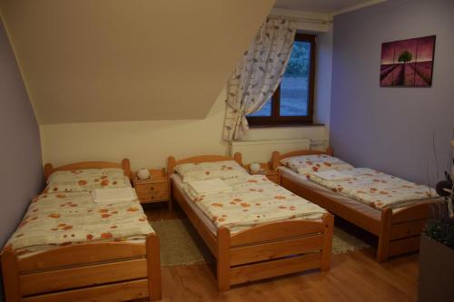 Postel nebo postele na pokoji v ubytování Penzión Vínny Dom