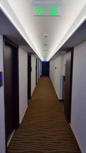 a hallway in an office building with a hallwayngthngthngthngthngthngthngth at Breeze Boutique Athens by Prima Hotels in Athens