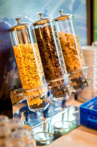 three glass containers filled with different types of food at Laemtong Serviced Apartment in Si Racha