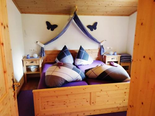 a bedroom with a bed with a canopy at Ferienwohnungen Wilhelmer in Liesing