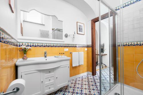 a bathroom with a sink and a shower at Palazzo delle Grazie in Sorrento