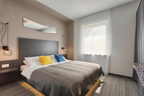 Posteľ alebo postele v izbe v ubytovaní Astinian apartments Jadranka