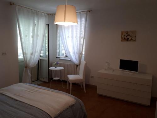 Posteľ alebo postele v izbe v ubytovaní B&B Casa di Laura