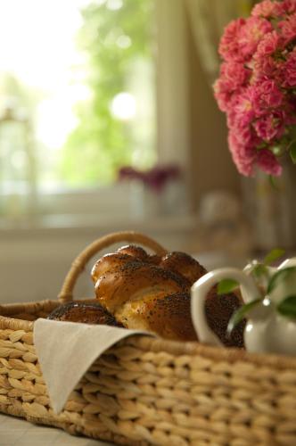 a basket with a loaf of bread on a table at Hotel Flora in Łódź