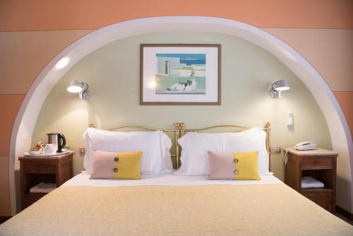 Postel nebo postele na pokoji v ubytování Hotel Antica Stallera