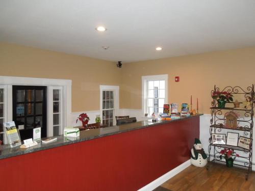 a large room with a long counter in a store at Colonial Motel in North Conway