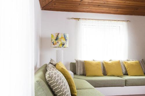 a living room with a couch and a window at Herdade da Sanguinheira in Longomel
