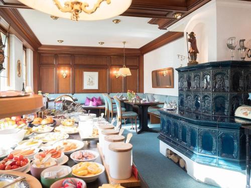 a long table filled with plates of food at Hotel Restaurant Krehl's Linde in Stuttgart