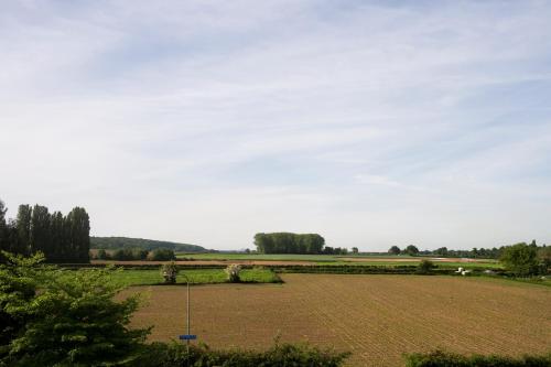 a large field with a large dirt field at Hotel Restaurant in den Hoof in Maastricht