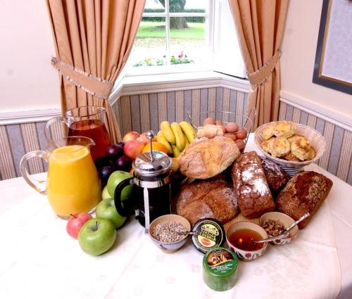 a table topped with lots of different types of food at Killiane Castle Country House & Farm in Wexford