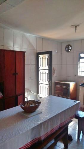 a kitchen with a table with a bowl on it at Casa de Campos do Jordão in Campos do Jordão
