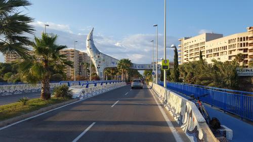 a car driving down a road on a bridge at Magnificas vistas al mar in Oropesa del Mar