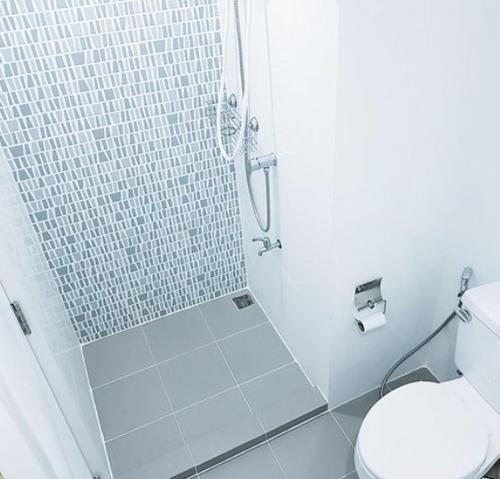 a bathroom with a shower and a toilet at Icondo Salaya Mahidol university (Salaya campus) in Salaya