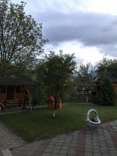 a park with a playground with a play area at Guest House Perlyna in Verkhovyna
