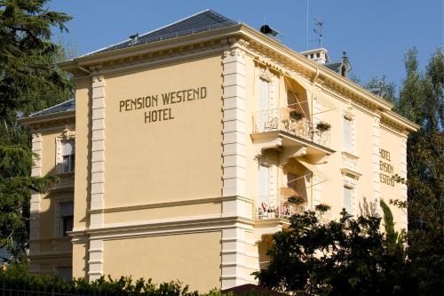 a building with a sign that reads pensionween hotel at Hotel Villa Westend in Merano