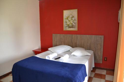 Ένα ή περισσότερα κρεβάτια σε δωμάτιο στο Pousada Sitio Bom Fim