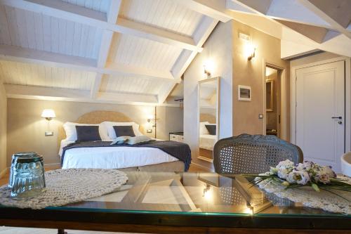 Postel nebo postele na pokoji v ubytování Relais Villa Miraglia