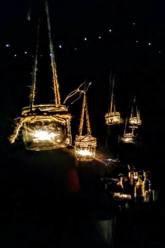 a group of boats with lights in the water at night at Miętowy Anioł in Ustrzyki Dolne