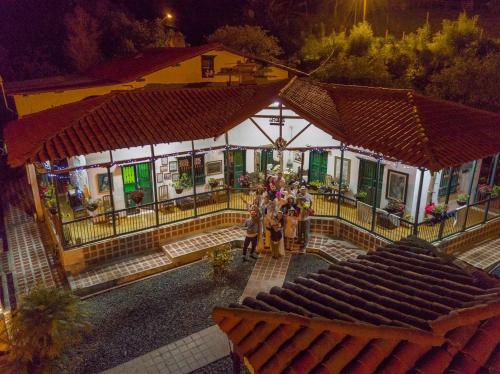 a group of people standing in front of a building at Finca Campestre La Adelita B&B in Salento