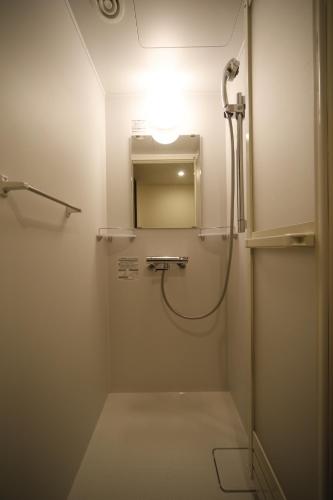 Koupelna v ubytování Dormy Inn Oita