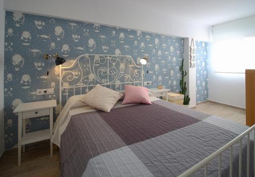Ένα ή περισσότερα κρεβάτια σε δωμάτιο στο Apartamentos Óliver Playa