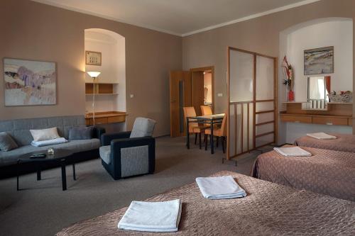 Postel nebo postele na pokoji v ubytování Hotel Merlot
