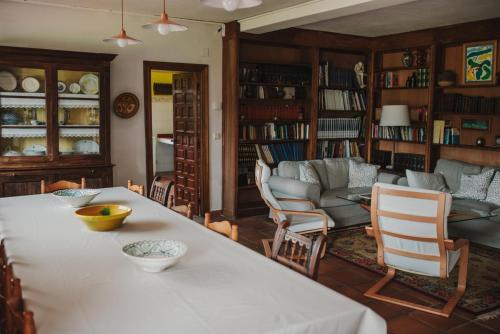 a living room with a large table and chairs at Casa Firmo in Quintana