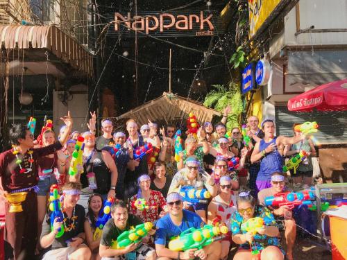 a large group of people are posing for a picture at Nappark Hostel @Khao San in Bangkok
