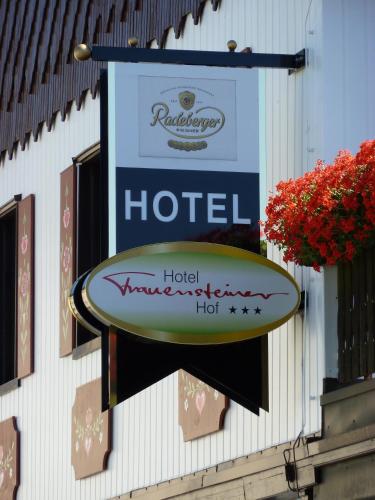 a sign for a hotel on the side of a building at Hotel Frauensteiner Hof in Frauenstein