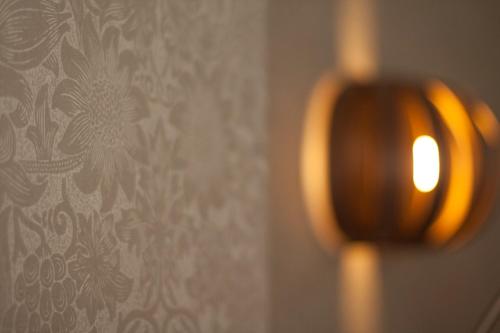 a close up of a light on a wall at Ascot House in Harrogate