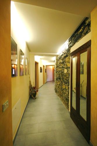 a hallway of a building with a stone wall at Villa Paggi Country House in Carasco