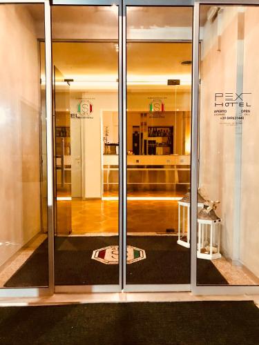a glass door of a building with a kitchen at Hotel Pex Padova in Rubano