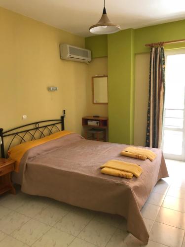 
Ένα ή περισσότερα κρεβάτια σε δωμάτιο στο Remezzo Apartments
