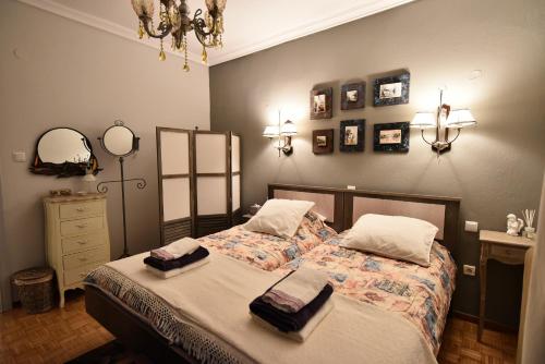 Ένα ή περισσότερα κρεβάτια σε δωμάτιο στο Queens Bed&Rest Luxury Apartment