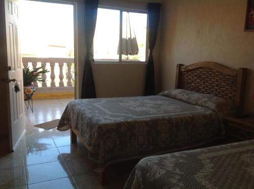 מיטה או מיטות בחדר ב-Casona de Cantera