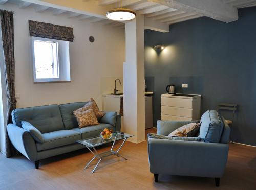 a living room with a couch and a table at Pieve Suites in Città della Pieve