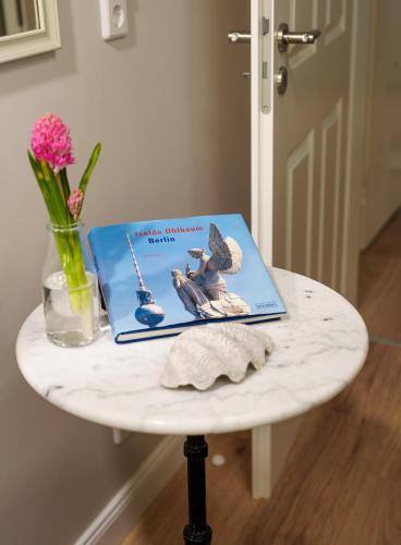 a book sitting on top of a table at Ferienwohnung Berlin in Berlin