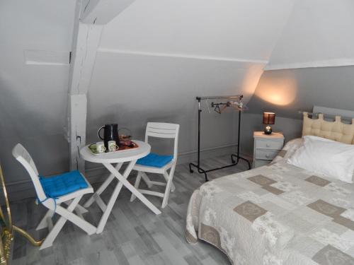 En eller flere senge i et værelse på Les Coquillettes