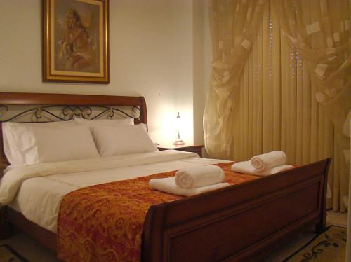 Ένα ή περισσότερα κρεβάτια σε δωμάτιο στο Litochoro Apartments