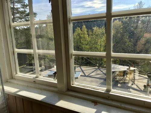 a window with a view of a patio at Näkna Hill in Åby