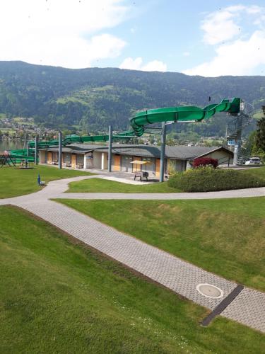 a water park with a slide in the grass at Ferienwohnung Kamot in Steindorf am Ossiacher See