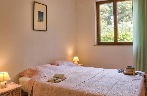 a bedroom with a bed and a window at Apartment Borik in Pula